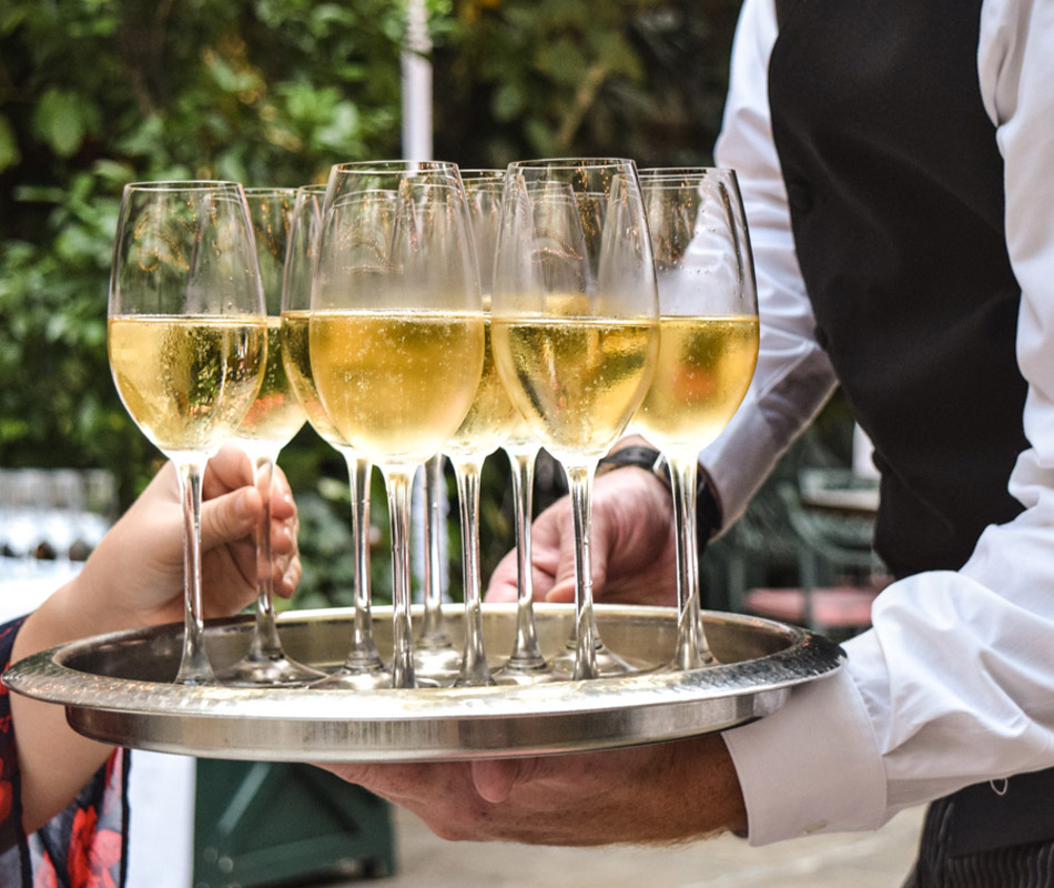 Waiter holding Champagne at Brennan's