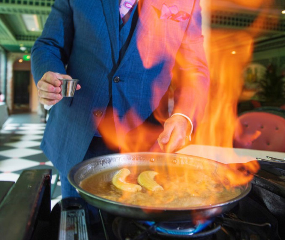 Waiter providing table-side dining at Brennan's